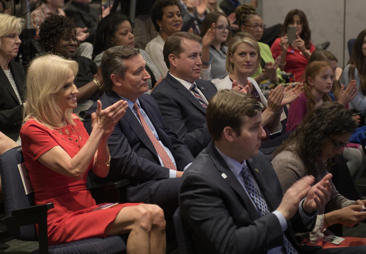 Counselor to the President of the United States Kellyanne Conway, left, Sen. Ted Cruz, R-Texas, and NASA Chief Financial Officer Jeff DeWit are seen in the audience during the swearing in of Jim Bridenstine as the 13th NASA Administrator by Vice President Mike Pence, Monday, April 23, 2018 at NASA Headquarters in Washington. Photo Credit: (NASA/Bill Ingalls)