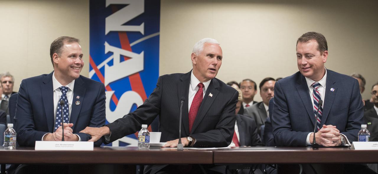 NASA Administrator Jim Bridenstine, left, is congratulated by Vice President Mike Pence, as NASA Chief Financial Officer, Jeff DeWit looks on, Monday, April 23, 2018 at NASA Headquarters in Washington. Bridenstine was just sworn in by the Vice President as NASA's 13th Administrator. Photo Credit: (NASA/Aubrey Gemignani)