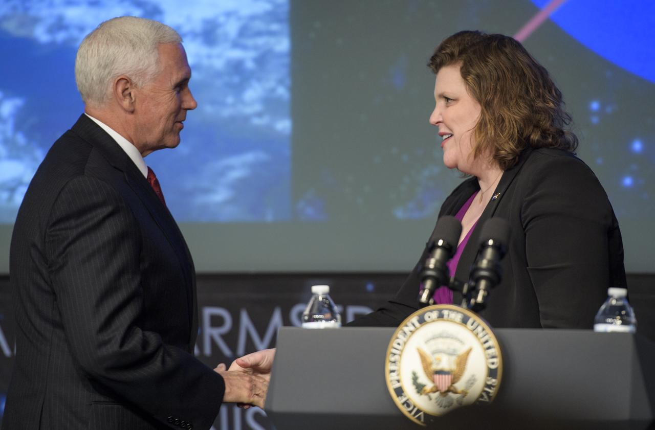 NASA Associate Administrator for the Office of Communications Jen Rae Wang greets Vice President Mike Pence after introducing him prior to the swearing-in of Jim Bridenstine as the 13th NASA Administrator,  Monday, April 23, 2018 at NASA Headquarters in Washington. Photo Credit: (NASA/Joel Kowsky)