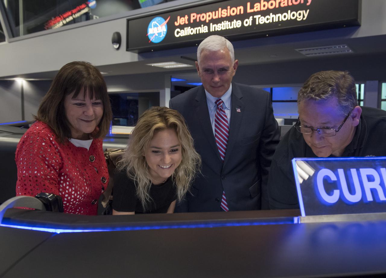 U.S. Vice President Mike Pence, his wife Karen, and their daughter Charlotte are shown how to send a command to the Curiosity rover on Mars by Mars Curiosity Mission ACE Walt Hoffman during a tour of NASA's Jet Propulsion Laboratory, Saturday, April 28, 2018 in Pasadena, California. Hoffman asked Charlotte Pence if she would do the honors of sending the command to the rover. Photo Credit: (NASA/Bill Ingalls)