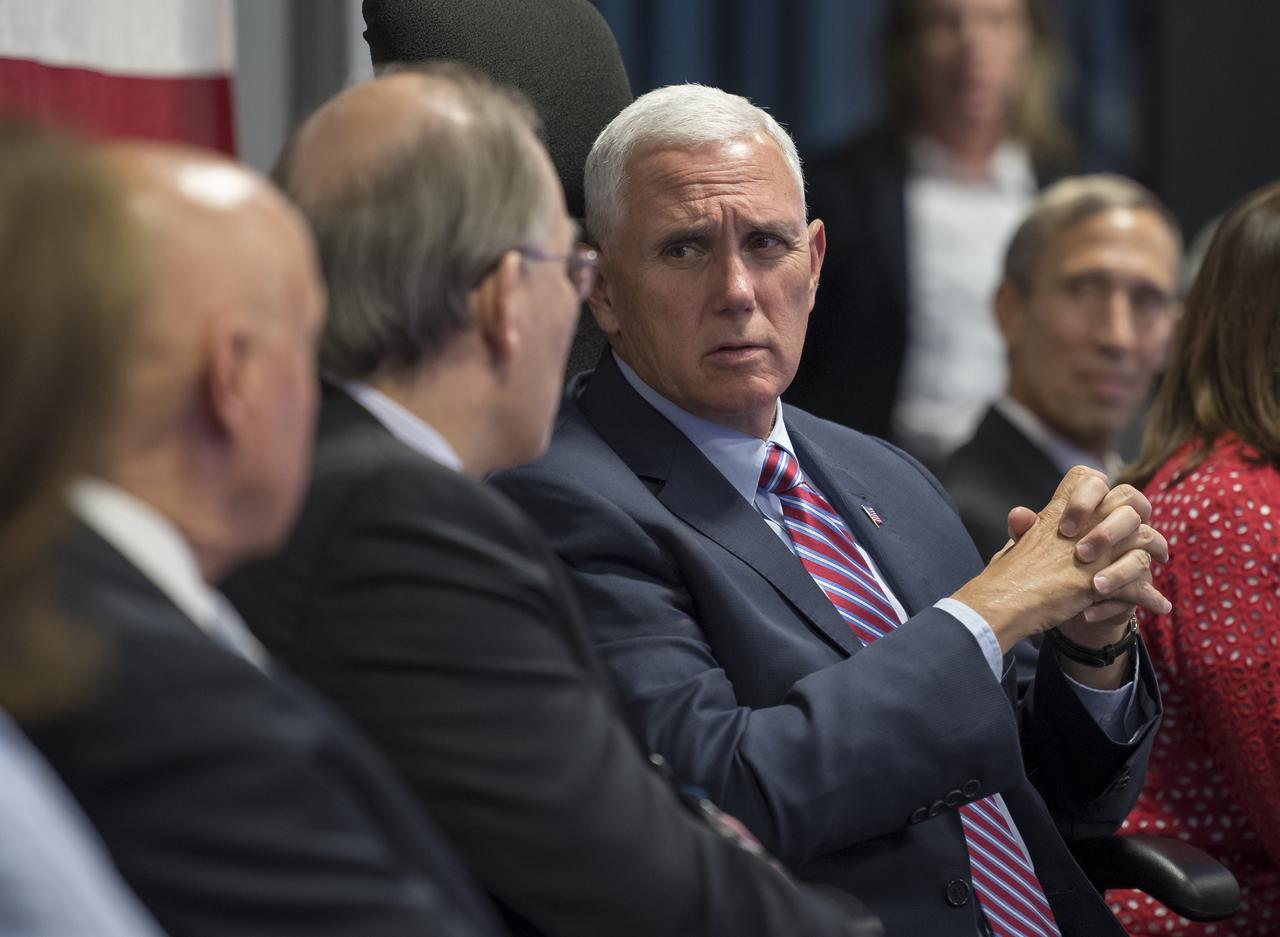 U.S. Vice President Mike Pence turns and talks with Executive Director of the National Space Council Scott Pace during a tour of NASA's Jet Propulsion Laboratory, Saturday, April 28, 2018 in Pasadena, California. Photo Credit: (NASA/Bill Ingalls)