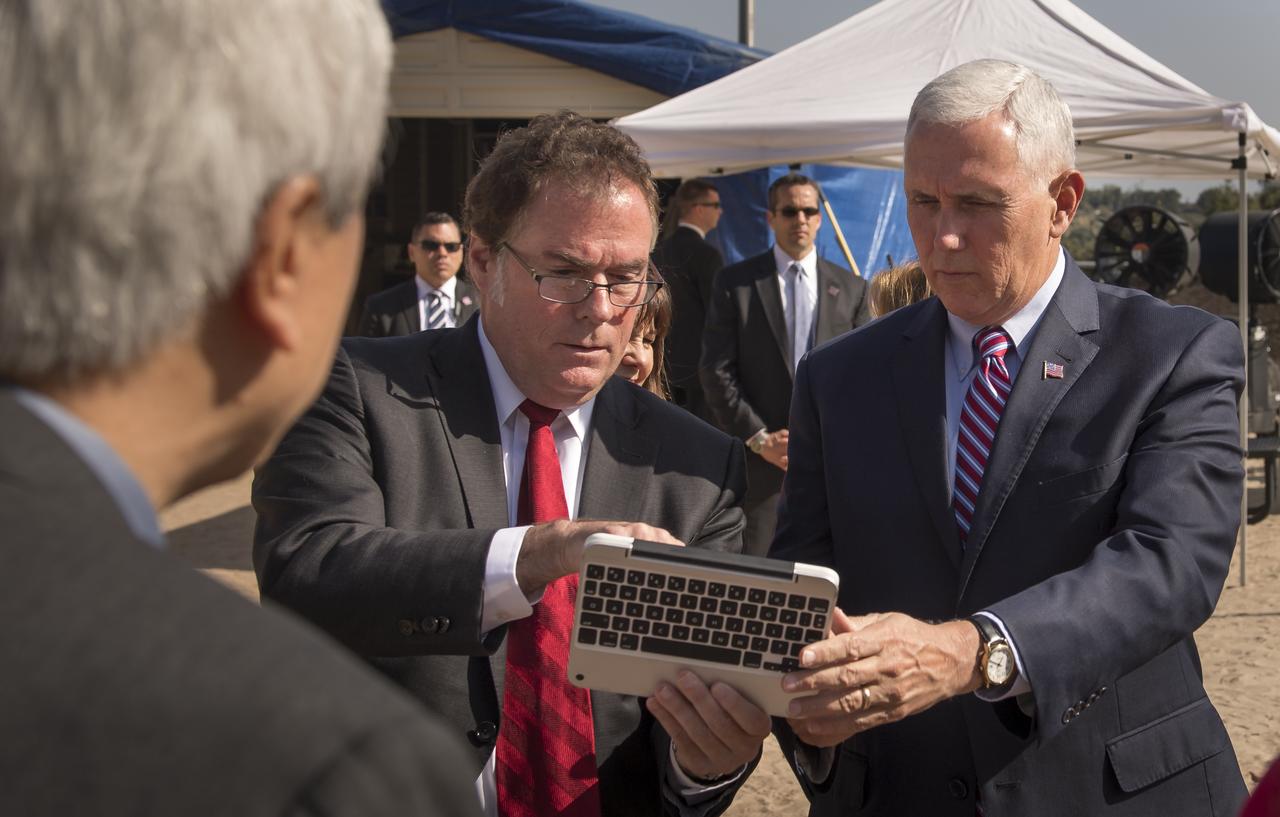 U.S. Vice President Mike Pence is given instructions on how to drive a rover nicknamed "Scarecrow" by JPL Director Michael Watkins at NASA's Jet Propulsion Laboratory Mars Yard, Saturday, April 28, 2018 in Pasadena, California. Scarecrow is used to test mobility of rovers on Mars. Photo Credit: (NASA/Bill Ingalls)