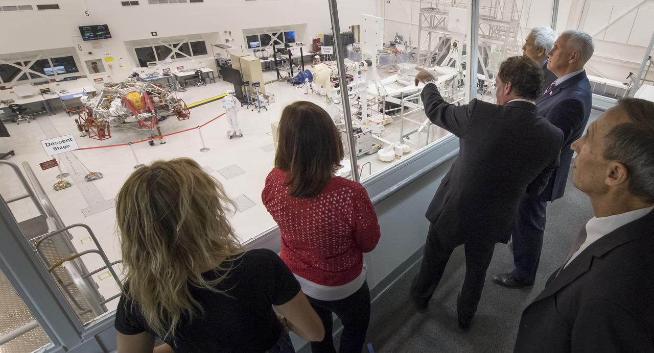 U.S. Vice President Mike Pence, 2nd from right, is shown the Mars 2020 spacecraft descent stage from inside the Spacecraft Assembly Facility (SAF) by JPL Director Michael Watkins, to the Vice President's left, and NASA Mars Exploration Manager Li Fuk at NASA's Jet Propulsion Laboratory, Saturday, April 28, 2018 in Pasadena, California. Mars 2020 is a Mars rover mission by NASA's Mars Exploration Program with a planned launch in 2020. Photo Credit: (NASA/Bill Ingalls)