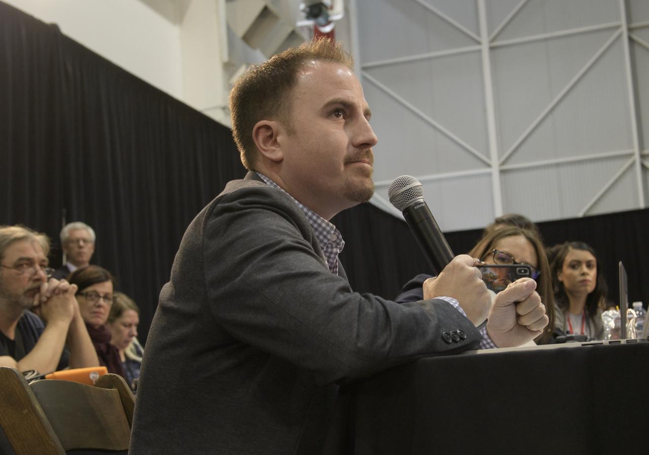 Jason Townsend, NASA's Deputy Social Media Manager, reads questions submitted by online social media followers during a prelaunch media briefing for NASA's InSight mission, Thursday, May 3, 2018, at Vandenberg Air Force Base in California. InSight, short for Interior Exploration using Seismic Investigations, Geodesy and Heat Transport, is a Mars lander designed to study the "inner space" of Mars: its crust, mantle, and core. Photo Credit: (NASA/Bill Ingalls)