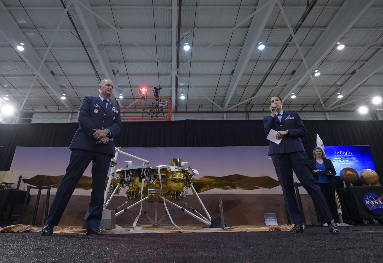 Col. Michael Hough, Commander 30th Space Wing, Vandenberg Air Force Base, left, and 1st Lieutenant Kristina Williams, weather officer, 30th Space Wing, Vandenberg Air Force Base, discuss NASA's InSight mission during a prelaunch media briefing, Thursday, May 3, 2018, at Vandenberg Air Force Base in California. InSight, short for Interior Exploration using Seismic Investigations, Geodesy and Heat Transport, is a Mars lander designed to study the "inner space" of Mars: its crust, mantle, and core. Photo Credit: (NASA/Bill Ingalls)