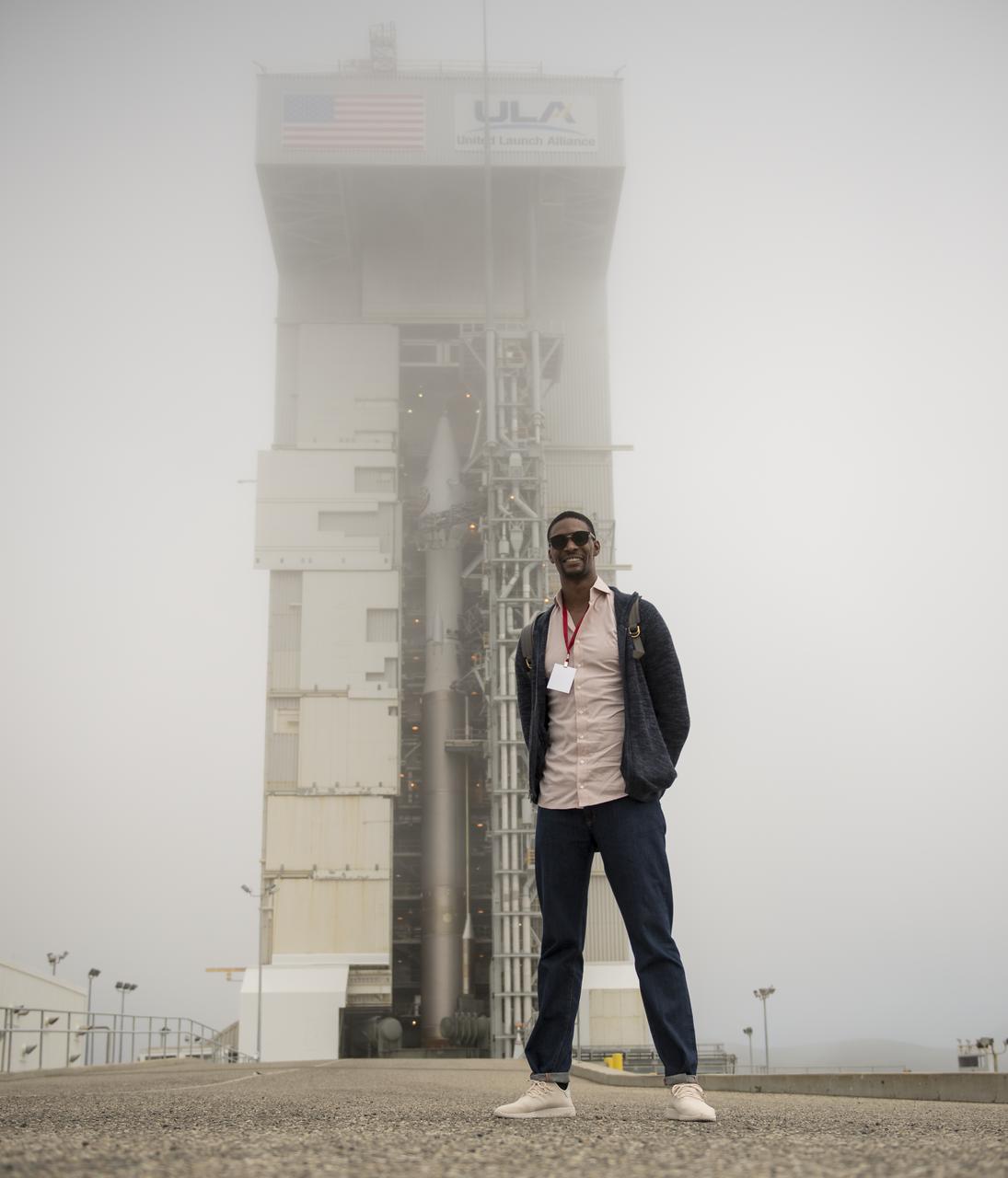 American professional basketball player Chris Bosh poses for a photograph in front of the United Launch Alliance (ULA) Atlas-V rocket with NASA's InSight spacecraft onboard, Friday, May 4, 2018, at Vandenberg Air Force Base in California. Bosh joined other social media guests on a behind the scenes tour ahead of the planned launch. InSight, short for Interior Exploration using Seismic Investigations, Geodesy and Heat Transport, is a Mars lander designed to study the "inner space" of Mars: its crust, mantle, and core. Photo Credit: (NASA/Bill Ingalls)