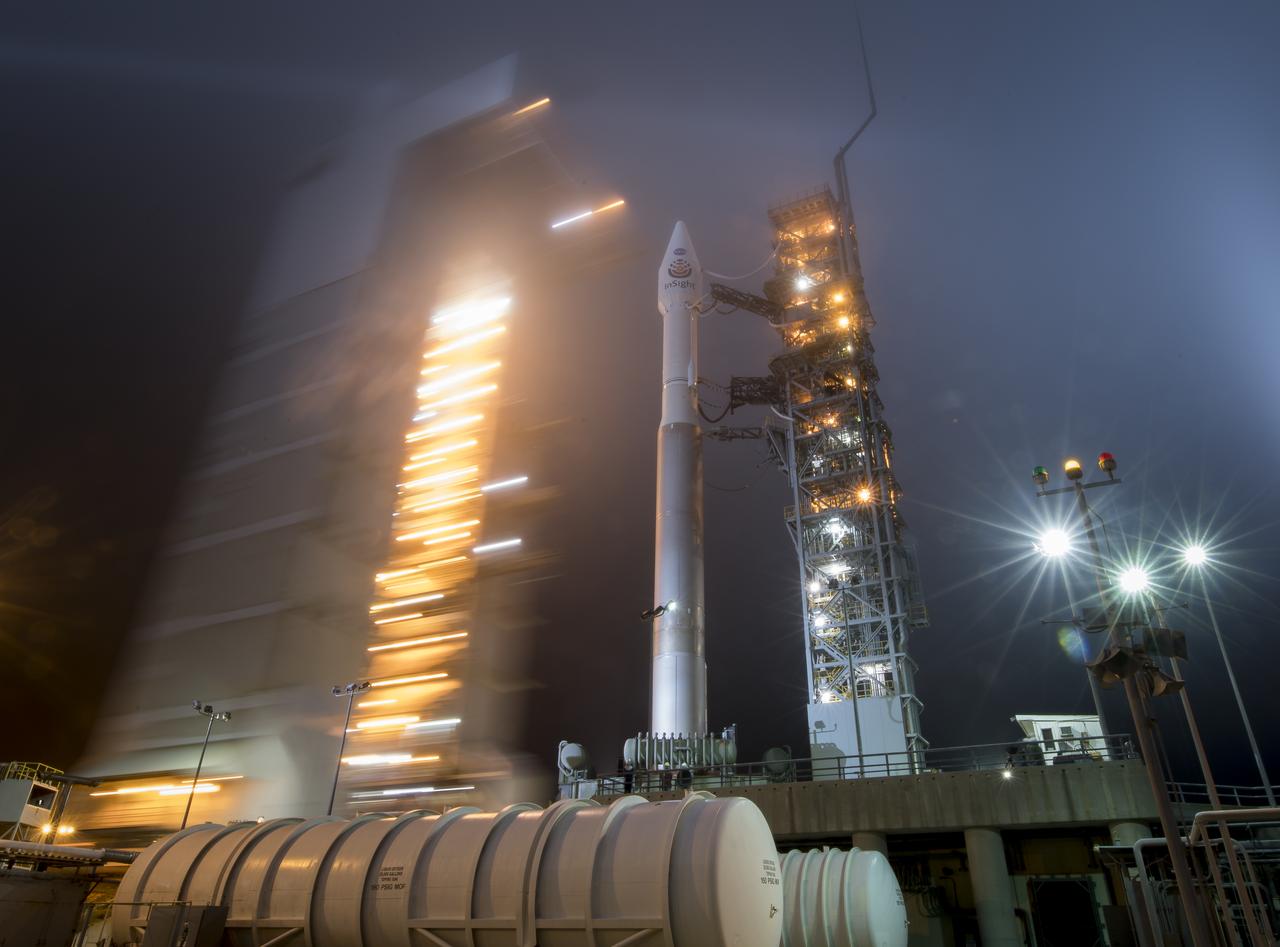 The mobile service tower at SLC-3 is rolled back to reveal the United Launch Alliance (ULA) Atlas-V rocket with the NASA InSight spacecraft onboard, Friday, May 4, 2018, at Vandenberg Air Force Base in California. InSight, short for Interior Exploration using Seismic Investigations, Geodesy and Heat Transport, is a Mars lander designed to study the "inner space" of Mars: its crust, mantle, and core. Photo Credit: (NASA/Bill Ingalls)