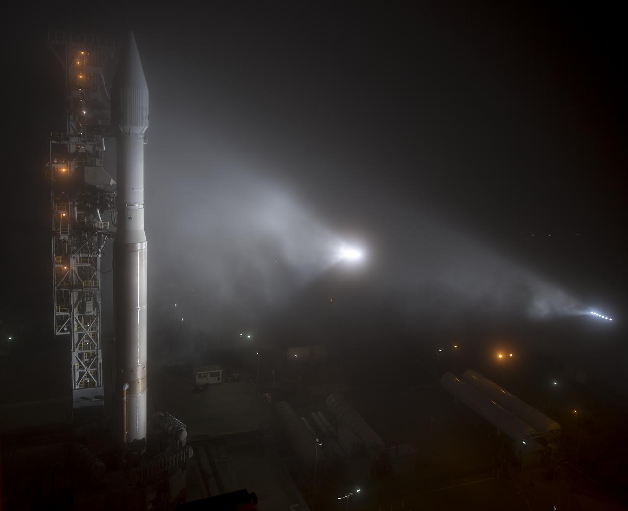 The United Launch Alliance (ULA) Atlas-V rocket with the NASA InSight spacecraft onboard is seen shortly after the mobile service tower was rolled back, Friday, May 4, 2018, at Vandenberg Air Force Base in California. InSight, short for Interior Exploration using Seismic Investigations, Geodesy and Heat Transport, is a Mars lander designed to study the "inner space" of Mars: its crust, mantle, and core. Photo Credit: (NASA/Bill Ingalls)
