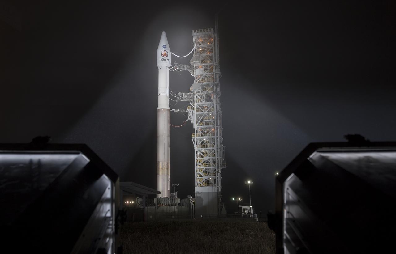 The United Launch Alliance (ULA) Atlas-V rocket with the NASA InSight spacecraft onboard is seen shortly after the mobile service tower was rolled back, Friday, May 4, 2018, at Vandenberg Air Force Base in California. InSight, short for Interior Exploration using Seismic Investigations, Geodesy and Heat Transport, is a Mars lander designed to study the "inner space" of Mars: its crust, mantle, and core. Photo Credit: (NASA/Bill Ingalls)