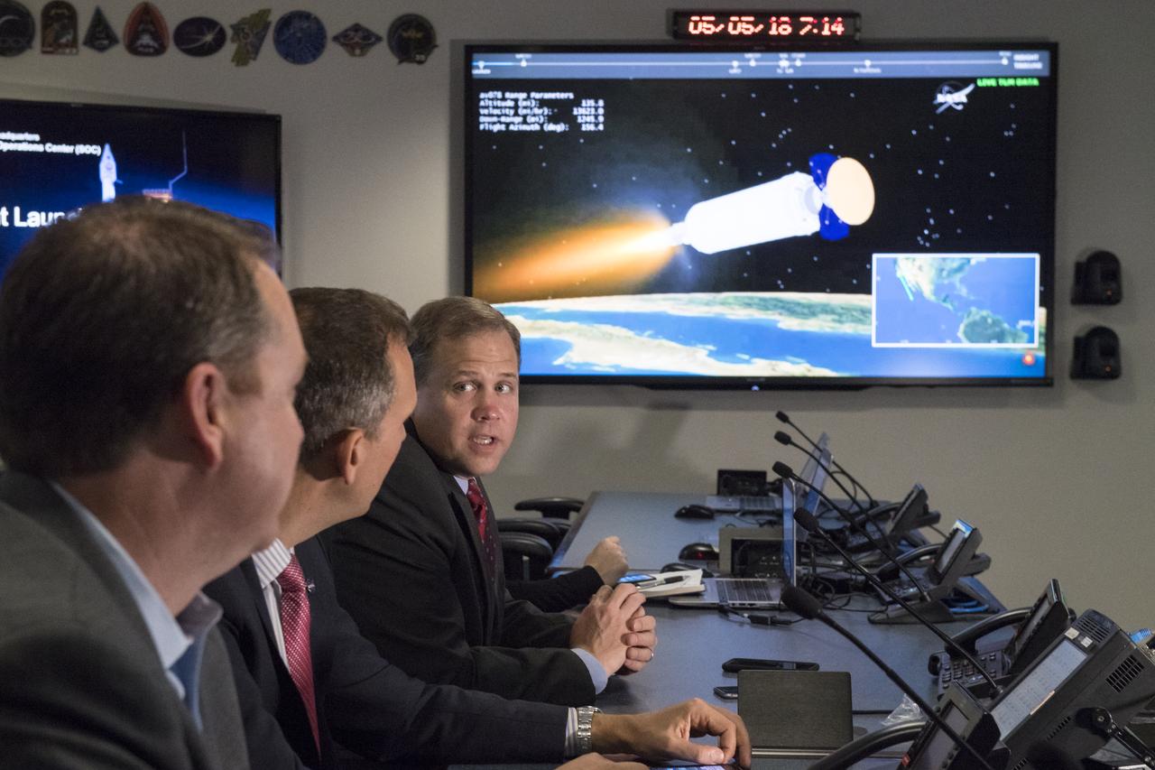 NASA Administrator Jim Bridenstine, right, speaks to NASA Associate Administrator for the Science Mission Directorate, Thomas Zurbuchen, center, and NASA Chief Financial Officer, Jeff DeWit, following the launch of NASA's InSight spacecraft on a United Launch Alliance (ULA) Atlas-V rocket Saturday, May 5, 2018 at NASA Headquarters in Washington. InSight, short for Interior Exploration using Seismic Investigations, Geodesy and Heat Transport, is a Mars lander designed to study the "inner space" of Mars: its crust, mantle, and core. Photo Credit: (NASA/Aubrey Gemignani)