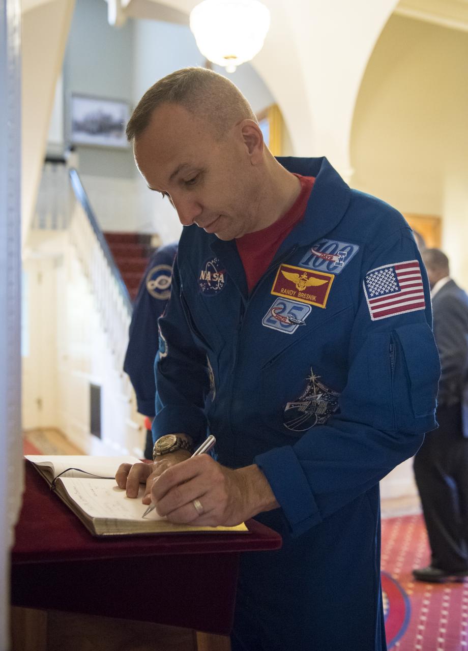 NASA astronaut Randy Bresnik signs the guest book before touring the Home of the Commandants of the Marine Corps, Monday, May 7, 2018 in Washington. Photo Credit: (NASA/Aubrey Gemignani)