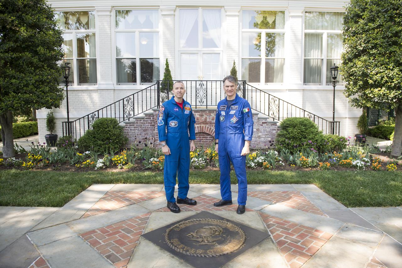 NASA astronaut Randy Bresnik, left, and ESA astronaut Paolo Nespoli, right, pose for a photo outside the Home of the Commandants of the Marine Corps, Monday, May 7, 2018 in Washington. Photo Credit: (NASA/Aubrey Gemignani)