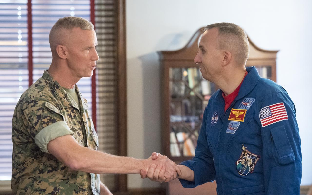 NASA astronaut Randy Bresnik, right, shakes hands with Colonel Tyler Zagurski, Commanding Officer, Marine Corps Barracks, Monday, May 7, 2018 in Washington. Photo Credit: (NASA/Aubrey Gemignani)