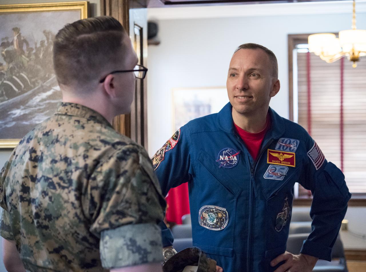 NASA astronaut Randy Bresnik speaks to a Marine about his time onboard the International Space Station after a tour of the Home of the Commandants of the Marine Corps, Monday, May 7, 2018 in Washington. Photo Credit: (NASA/Aubrey Gemignani)
