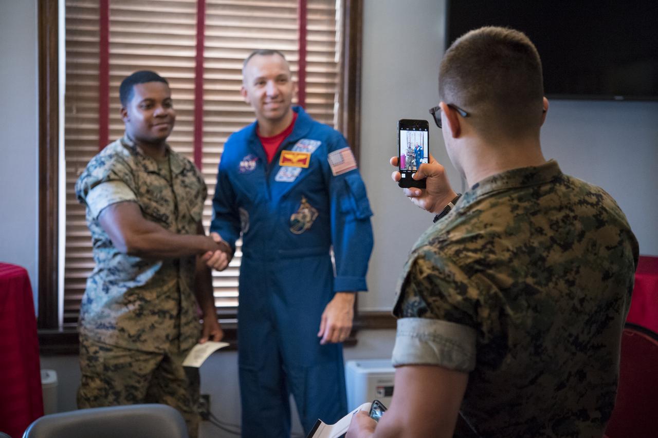 NASA astronaut Randy Bresnik poses for a photo with a Marine after speaking to them about his time onboard the International Space Station, Monday, May 7, 2018 in Washington. Photo Credit: (NASA/Aubrey Gemignani)