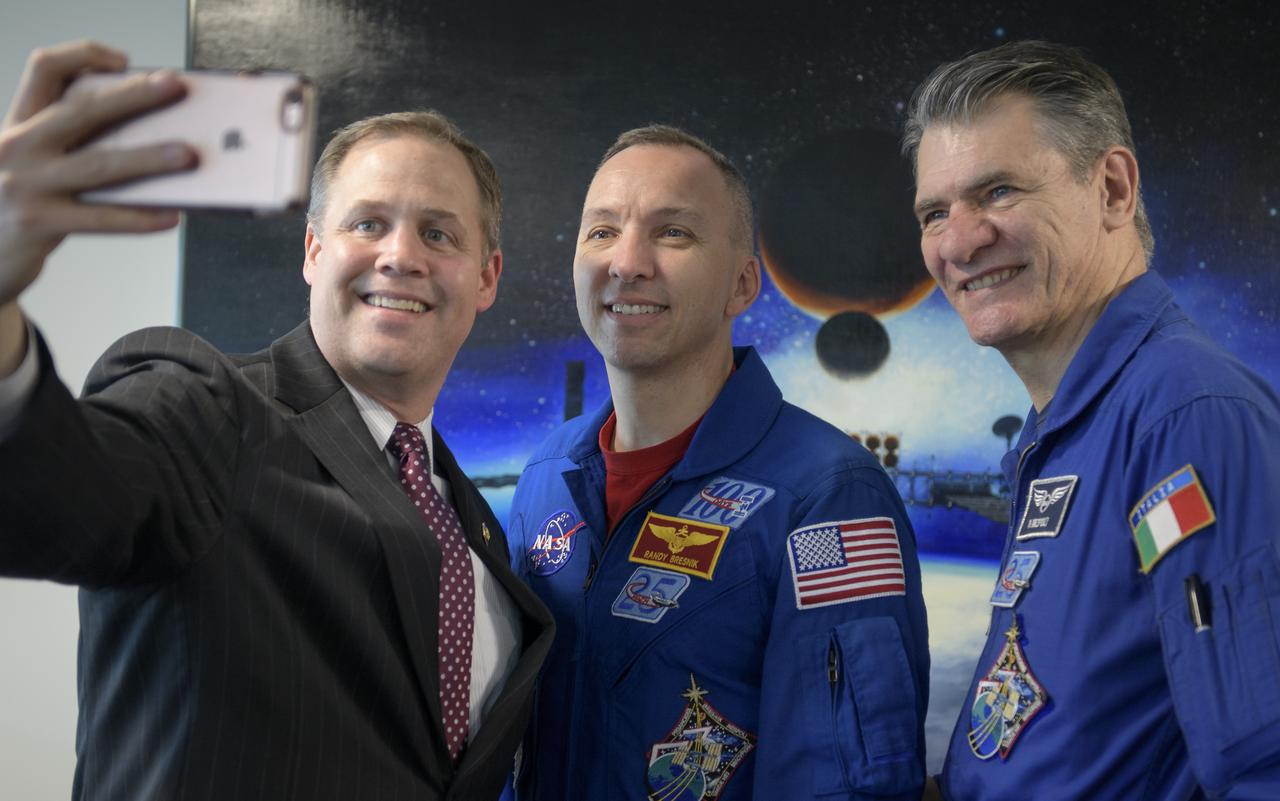 NASA Administrator Jim Bridenstine, left, makes a photograph with NASA astronaut Randy Bresnik, center, and ESA astronaut Paolo Nespoli, Wednesday, May 9, 2018 at NASA Headquarters in Washington. Photo Credit: (NASA/Bill Ingalls)