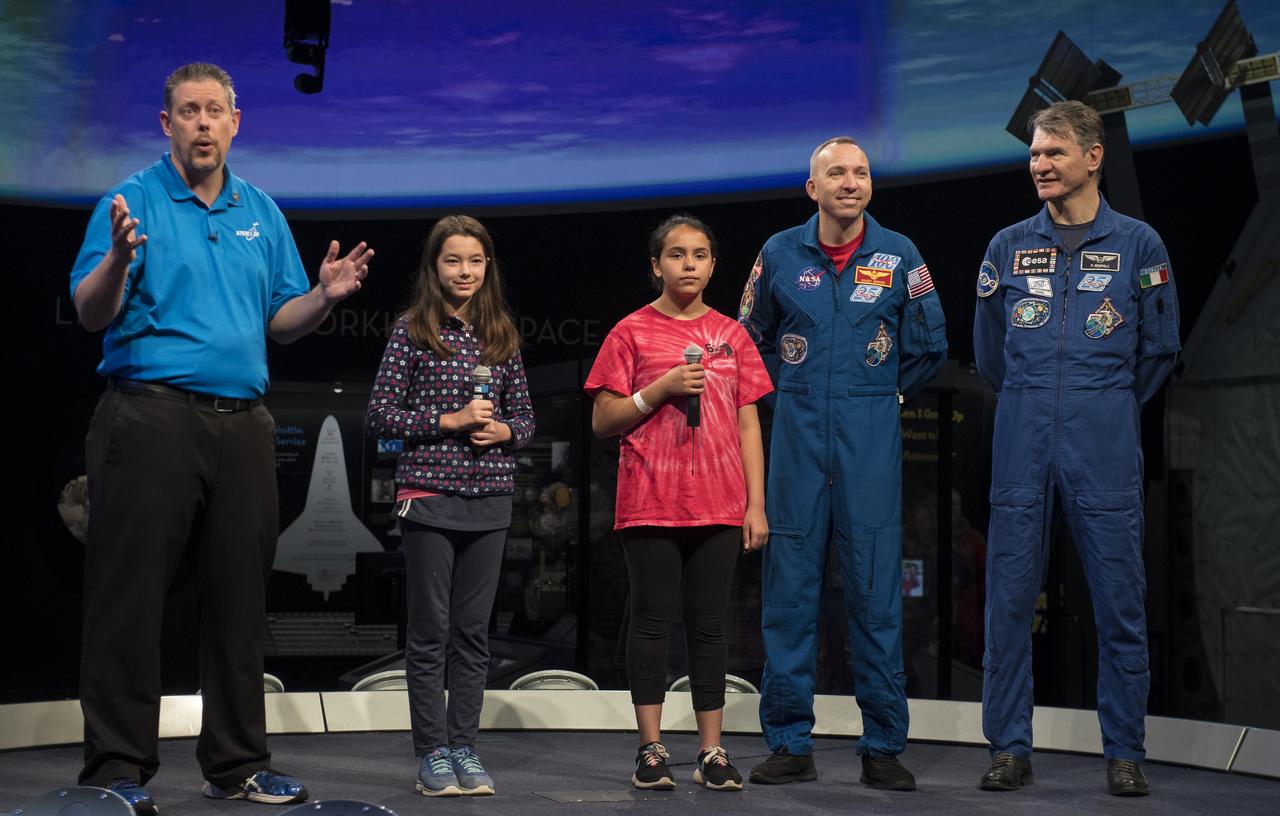 NASA astronaut Randy Bresnik, second from right, and ESA astronaut Paolo Nespoli, right, are introduced by STEM in 30's Marty Kelsey before speaking about their time onboard the International Space Station during expeditions 52/53, Thursday, May 10, 2018 at the Smithsonian National Air and Space Museum in Washington. Photo Credit: (NASA/Aubrey Gemignani)