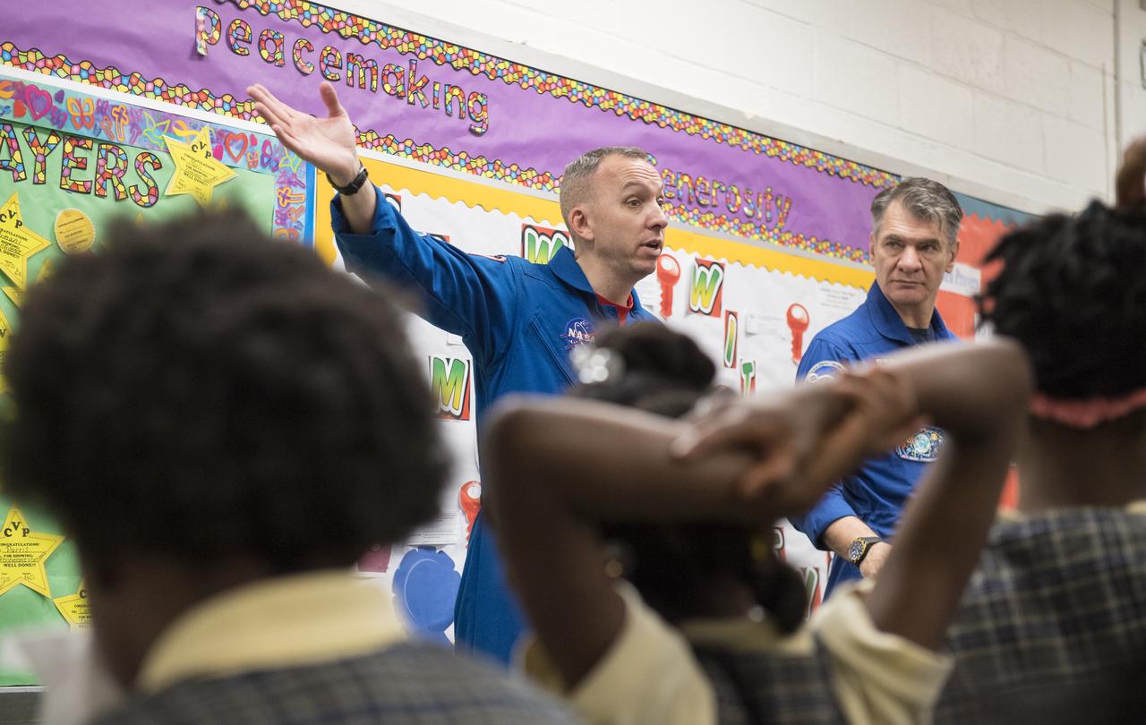 NASA astronaut Randy Bresnik, left, and ESA astronaut Paolo Nespoli answer questions about their time onboard the International Space Station during expeditions 52/53, Friday, May 11, 2018 at the Washington School for Girls in Washington. Photo Credit: (NASA/Aubrey Gemignani)