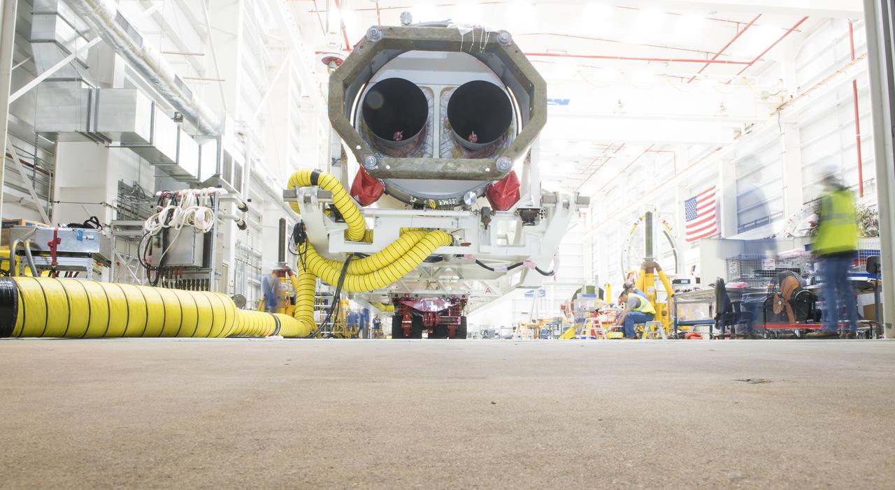 An Orbital ATK rocket is seen in this long exposure, as workers prepare to roll it out to launch Pad-0A at Wallops Flight Facility Thursday, May 17, 2018 at Wallops Island, VA. The Antares will launch a Cygnus spacecraft on a cargo resupply mission to the International Space Station. The mission is Orbital ATK’s ninth contracted cargo delivery flight to the space station for NASA. Included in the 7,400 pounds of cargo onboard Cygnus, are science experiments, crew supplies, and vehicle hardware. Photo Credit: (NASA/Aubrey Gemignani)