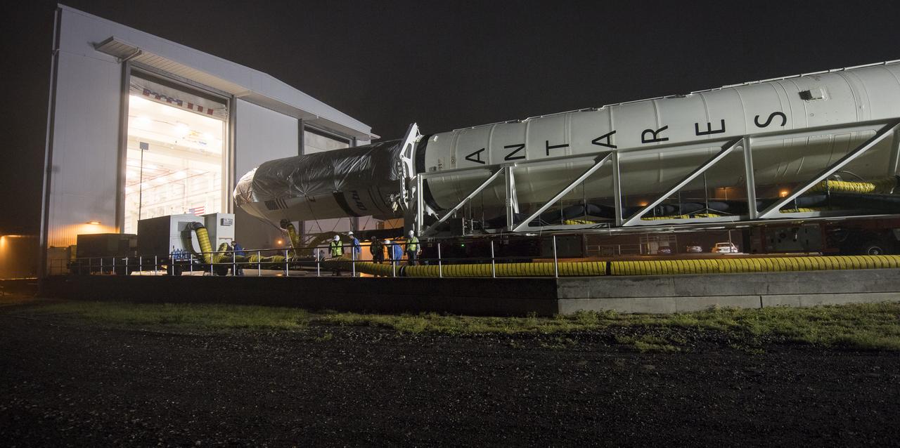 An Orbital ATK rocket is seen as it is rolled out to launch Pad-0A at Wallops Flight Facility Thursday, May 17, 2018 at Wallops Island, VA. The Antares will launch a Cygnus spacecraft on a cargo resupply mission to the International Space Station. The mission is Orbital ATK’s ninth contracted cargo delivery flight to the space station for NASA. Included in the 7,400 pounds of cargo onboard Cygnus, are science experiments, crew supplies, and vehicle hardware. Photo Credit: (NASA/Aubrey Gemignani)