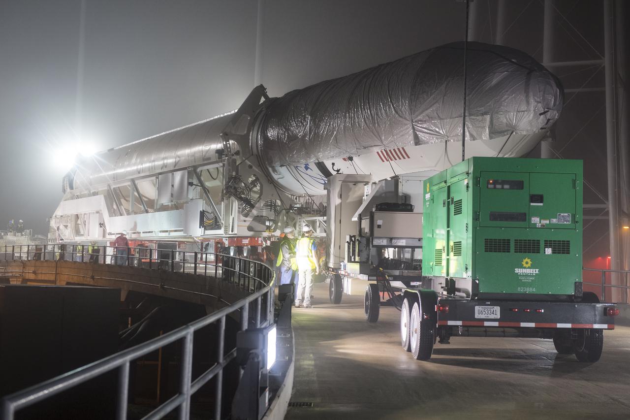 An Orbital ATK rocket is seen as it makes its final approach to launch Pad-0A at Wallops Flight Facility Thursday, May 17, 2018 at Wallops Island, VA. The Antares will launch a Cygnus spacecraft on a cargo resupply mission to the International Space Station. The mission is Orbital ATK’s ninth contracted cargo delivery flight to the space station for NASA. Included in the 7,400 pounds of cargo onboard Cygnus, are science experiments, crew supplies, and vehicle hardware. Photo Credit: (NASA/Aubrey Gemignani)