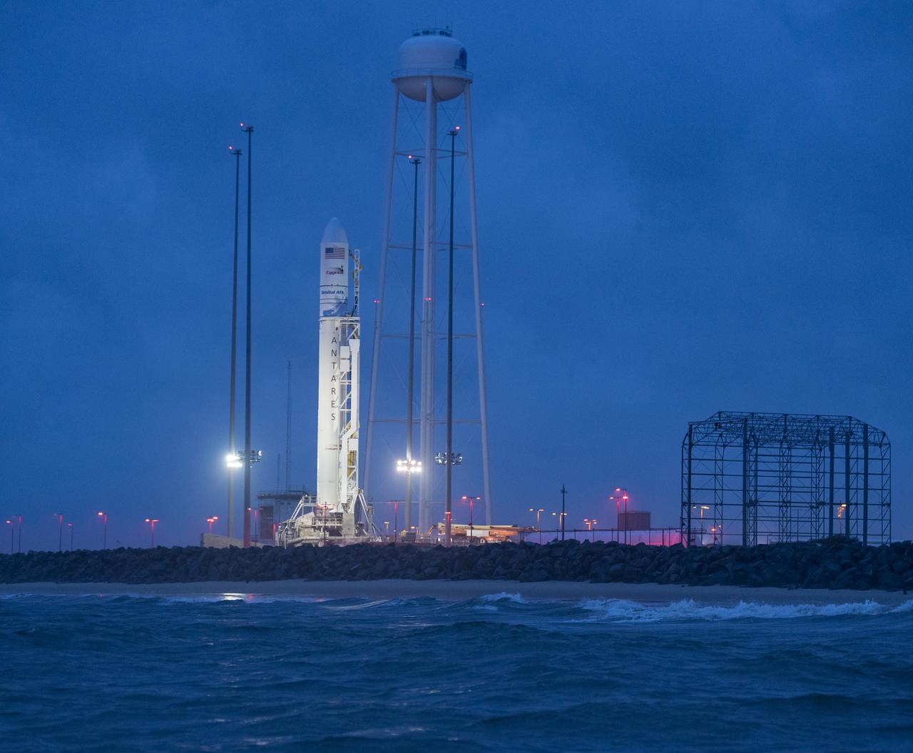 The Orbital ATK Antares rocket, with the Cygnus spacecraft onboard, is seen at launch Pad-0A, early Sunday, May 20, 2018 at Wallops Flight Facility in Virginia. The Antares will launch with the Cygnus spacecraft filled with 7,400 pounds of cargo for the International Space Station (ISS), including science experiments, crew supplies, and vehicle hardware. The mission is Orbital ATK's ninth contracted cargo delivery flight to ISS for NASA. Photo Credit: (NASA/Aubrey Gemignani)