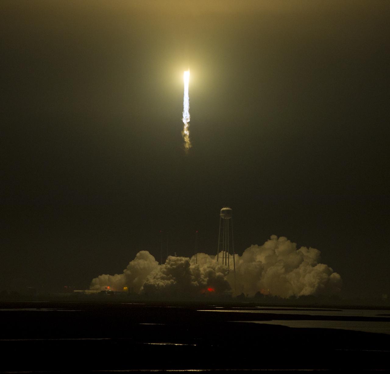 The Orbital ATK Antares rocket, with the Cygnus spacecraft onboard, launches from Pad-0A, Monday, May 21, 2018 at NASA's Wallops Flight Facility in Virginia. Orbital ATK’s ninth contracted cargo resupply mission with NASA to the International Space Station will deliver approximately 7,400 pounds of science and research, crew supplies and vehicle hardware to the orbital laboratory and its crew. Photo Credit: (NASA/Aubrey Gemignani)