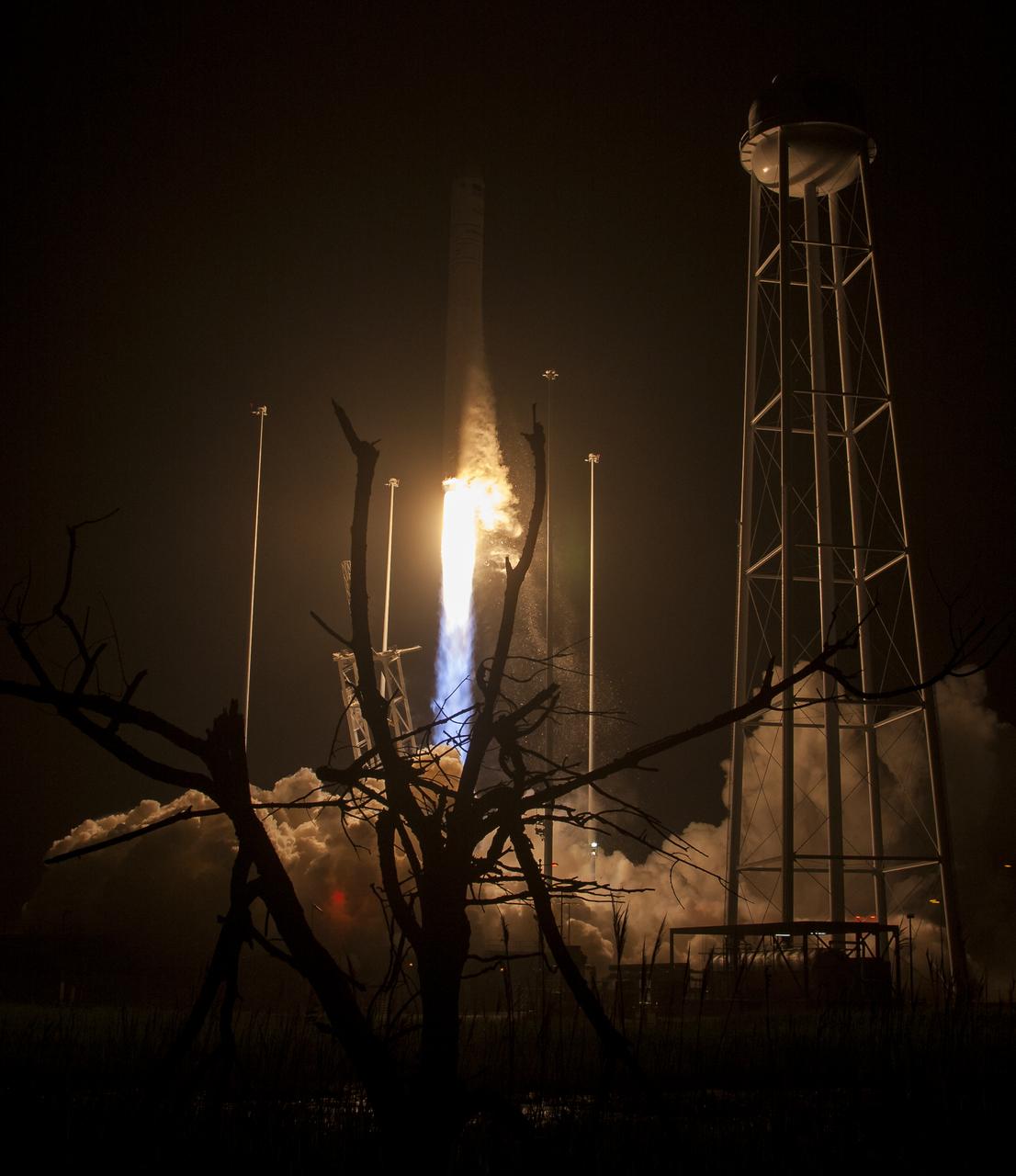 The Orbital ATK Antares rocket, with the Cygnus spacecraft onboard, launches from Pad-0A, Monday, May 21, 2018 at NASA's Wallops Flight Facility in Virginia. Orbital ATK’s ninth contracted cargo resupply mission with NASA to the International Space Station will deliver approximately 7,400 pounds of science and research, crew supplies and vehicle hardware to the orbital laboratory and its crew. Photo Credit: (NASA/Aubrey Gemignani)