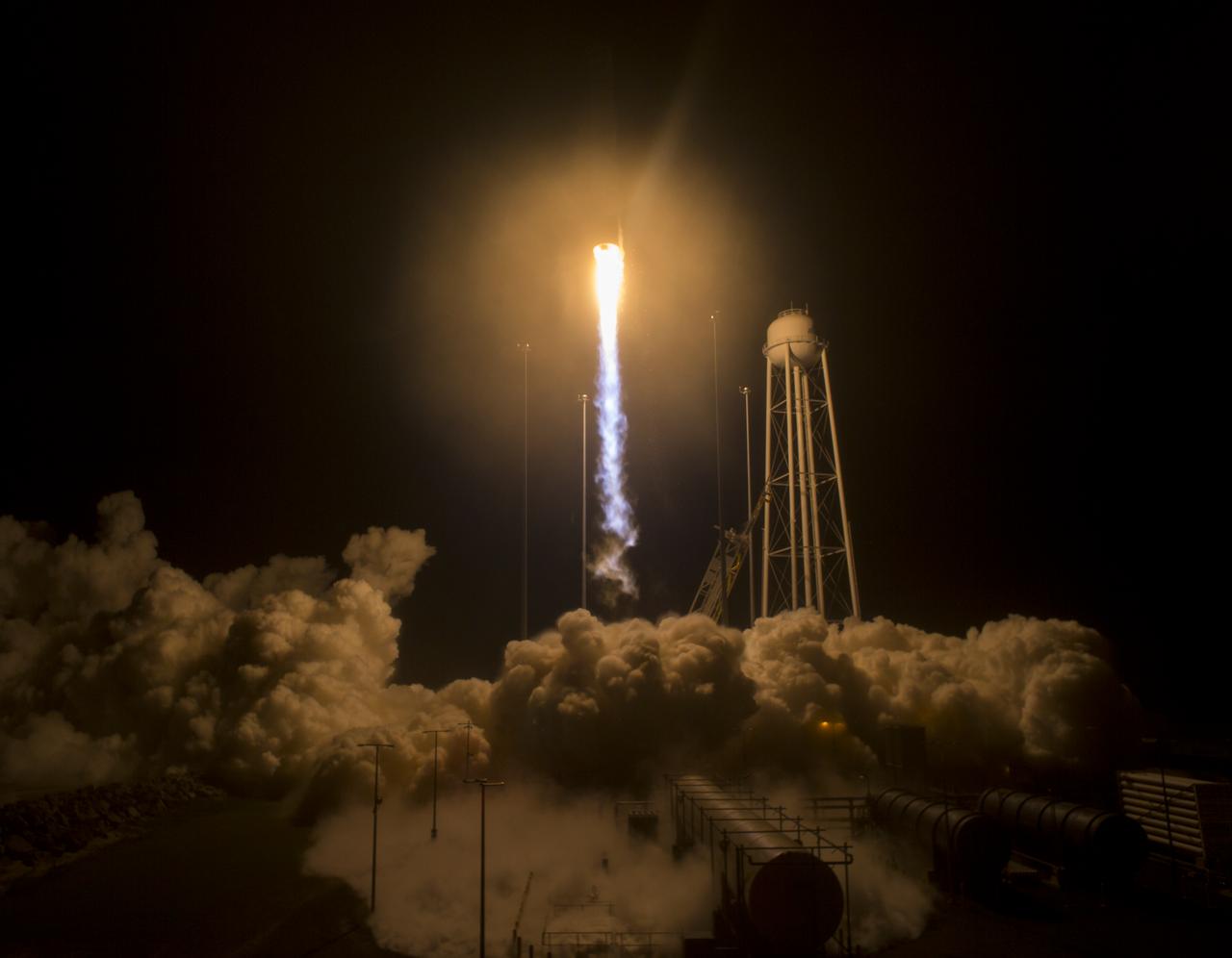 The Orbital ATK Antares rocket, with the Cygnus spacecraft onboard, launches from Pad-0A, Monday, May 21, 2018 at NASA's Wallops Flight Facility in Virginia. Orbital ATK’s ninth contracted cargo resupply mission with NASA to the International Space Station will deliver approximately 7,400 pounds of science and research, crew supplies and vehicle hardware to the orbital laboratory and its crew. Photo Credit: (NASA/Aubrey Gemignani)