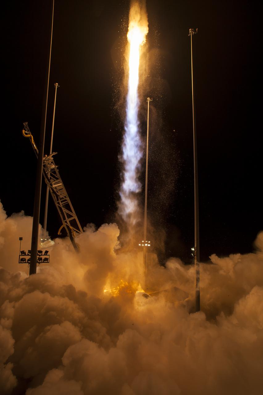The Orbital ATK Antares rocket, with the Cygnus spacecraft onboard, launches from Pad-0A, Monday, May 21, 2018 at NASA's Wallops Flight Facility in Virginia. Orbital ATK’s ninth contracted cargo resupply mission with NASA to the International Space Station will deliver approximately 7,400 pounds of science and research, crew supplies and vehicle hardware to the orbital laboratory and its crew. Photo Credit: (NASA/Aubrey Gemignani)