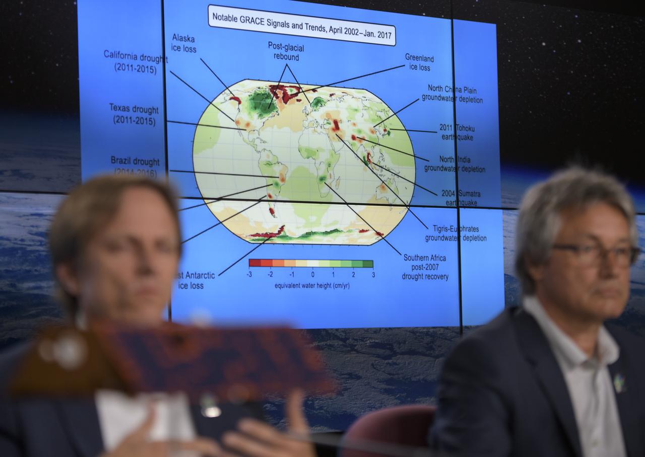 A graphic is shown as experts discuss the Gravity Recovery and Climate Experiment Follow-On (GRACE-FO) mission during a prelaunch media briefing, Monday, May 21, 2018, at Vandenberg Air Force Base in California. The twin GRACE-FO spacecraft will measure changes in how mass is redistributed within and among Earth's atmosphere, oceans, land and ice sheets, as well as within Earth itself. Photo Credit: (NASA/Bill Ingalls)
