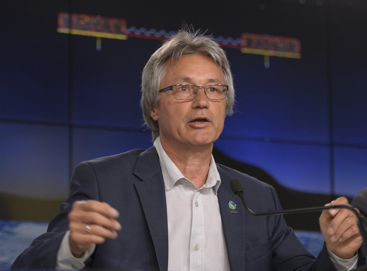 Frank Flechtner, GRACE-FO project manager for the German Research Centre for Geosciences (GFZ) in Potsdam, Germany, discusses the Gravity Recovery and Climate Experiment Follow-On (GRACE-FO) mission during a prelaunch media briefing, Monday, May 21, 2018, at Vandenberg Air Force Base in California. The twin GRACE-FO spacecraft will measure changes in how mass is redistributed within and among Earth's atmosphere, oceans, land and ice sheets, as well as within Earth itself. Photo Credit: (NASA/Bill Ingalls)