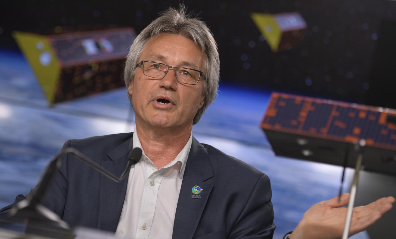 Frank Flechtner, GRACE-FO project manager for the German Research Centre for Geosciences (GFZ) in Potsdam, Germany, discusses the Gravity Recovery and Climate Experiment Follow-On (GRACE-FO) mission during a prelaunch media briefing, Monday, May 21, 2018, at Vandenberg Air Force Base in California. The twin GRACE-FO spacecraft will measure changes in how mass is redistributed within and among Earth's atmosphere, oceans, land and ice sheets, as well as within Earth itself. Photo Credit: (NASA/Bill Ingalls)