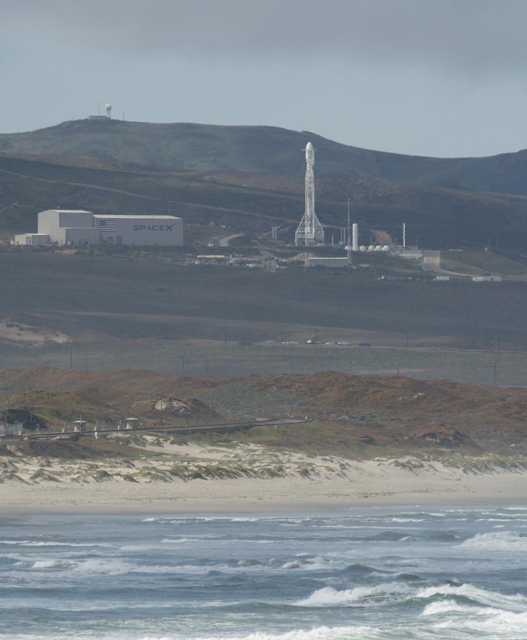 The SpaceX Falcon 9 rocket is seen with the NASA/German Research Centre for Geosciences GRACE Follow-On spacecraft onboard, Tuesday, May 22, 2018, at Space Launch Complex 4E at Vandenberg Air Force Base in California. The mission will measure changes in how mass is redistributed within and among Earth's atmosphere, oceans, land and ice sheets, as well as within Earth itself. GRACE-FO is sharing its ride to orbit with five Iridium NEXT communications satellites as part of a commercial rideshare agreement. Photo Credit: (NASA/Bill Ingalls)