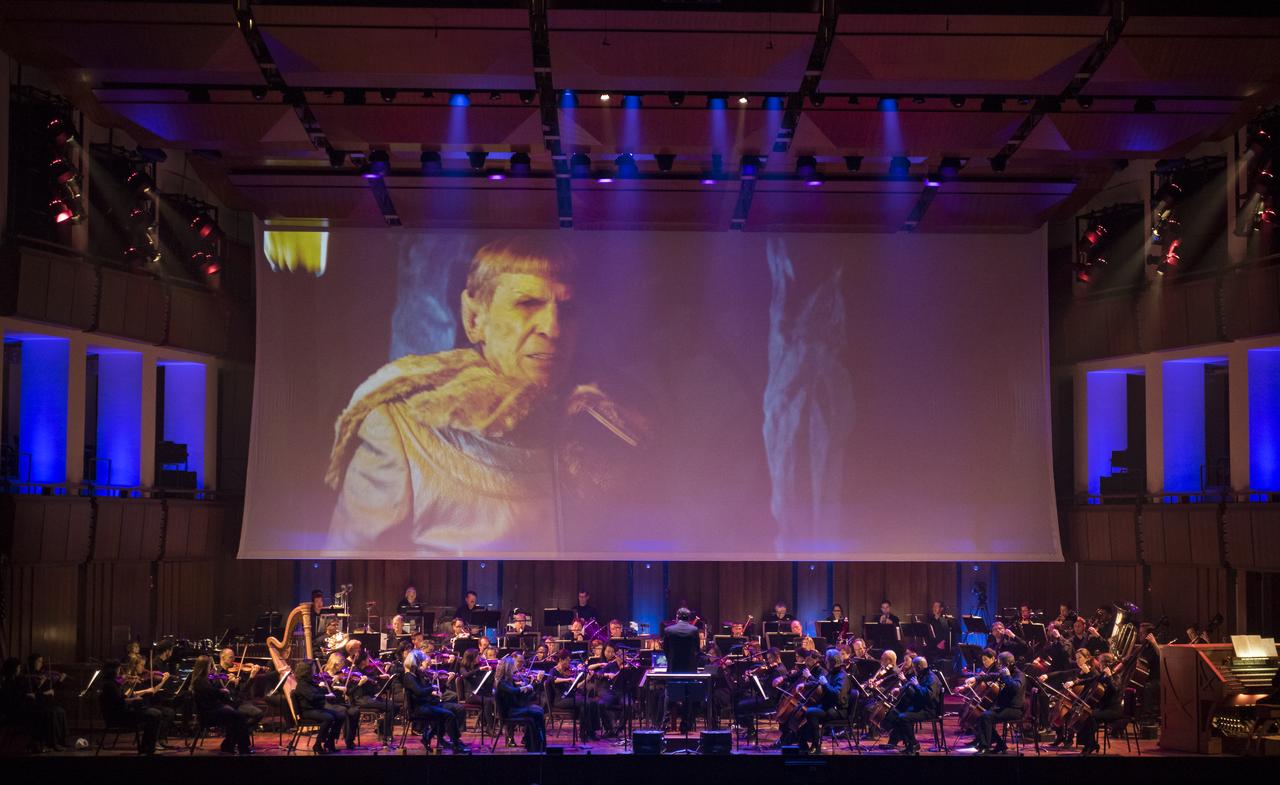 Star Trek composer Michael Giacchino conducts the National Symphony Orchestra during the "Space, the Next Frontier" event celebrating NASA's 60th Anniversary, Friday, June 1, 2018 at the John F. Kennedy Center for the Performing Arts in Washington. The event featured music inspired by space including artists will.i.am, Grace Potter, Coheed & Cambria, John Cho, and guest Nick Sagan, son of Carl Sagan. Photo Credit: (NASA/Aubrey Gemignani)