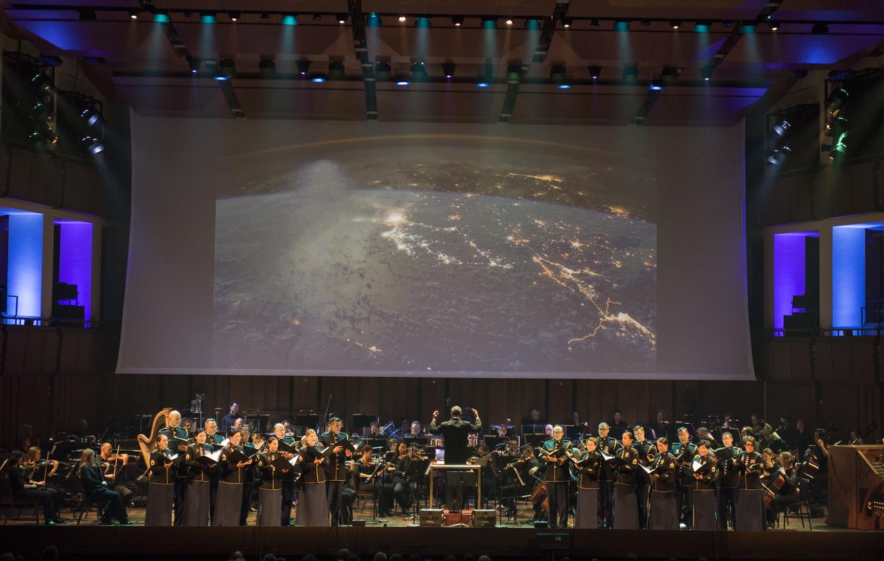 Conductor Emil de Cou leads the National Symphony Orchestra during the "Space, the Next Frontier" event celebrating NASA's 60th Anniversary, Friday, June 1, 2018 at the John F. Kennedy Center for the Performing Arts in Washington. The event featured music inspired by space including artists will.i.am, Grace Potter, Coheed & Cambria, John Cho, and guest Nick Sagan, son of Carl Sagan. Photo Credit: (NASA/Aubrey Gemignani)