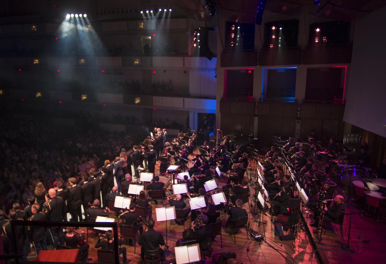 A NASA logo cake is brought onstage during the "National Symphony Orchestra Pops: Space, the Next Frontier" event celebrating NASA's 60th Anniversary, Friday, June 1, 2018 at the John F. Kennedy Center for the Performing Arts in Washington. The event featured music inspired by space including artists will.i.am, Grace Potter, Coheed & Cambria, John Cho, and guest Nick Sagan, son of Carl Sagan. Photo Credit: (NASA/Aubrey Gemignani)