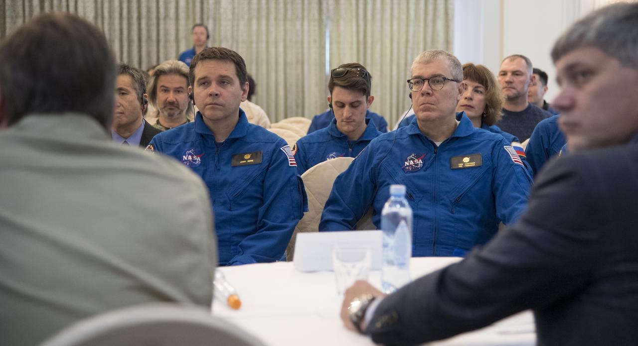 NASA Director for Human Space Flight Programs, Russia, Chad Rowe, left, and NASA Deputy International Space Station Program Manager Dan Hartman, right, are seen along with other NASA, Roscosmos, and JAXA team members during a meeting to discuss the readiness for the landing of Expedition 55 crew members  Anton Shkaplerov of Roscosmos, Scott Tingle of NASA, Norishige Kanai of the Japan Aerospace Exploration Agency (JAXA) Saturday, June 2, 2018. Shkaplerov, Tingle, and Kanai are returning after 168 days in space where they served as members of the Expedition 54 and 55 crews onboard the International Space Station. Photo Credit: (NASA/Bill Ingalls)