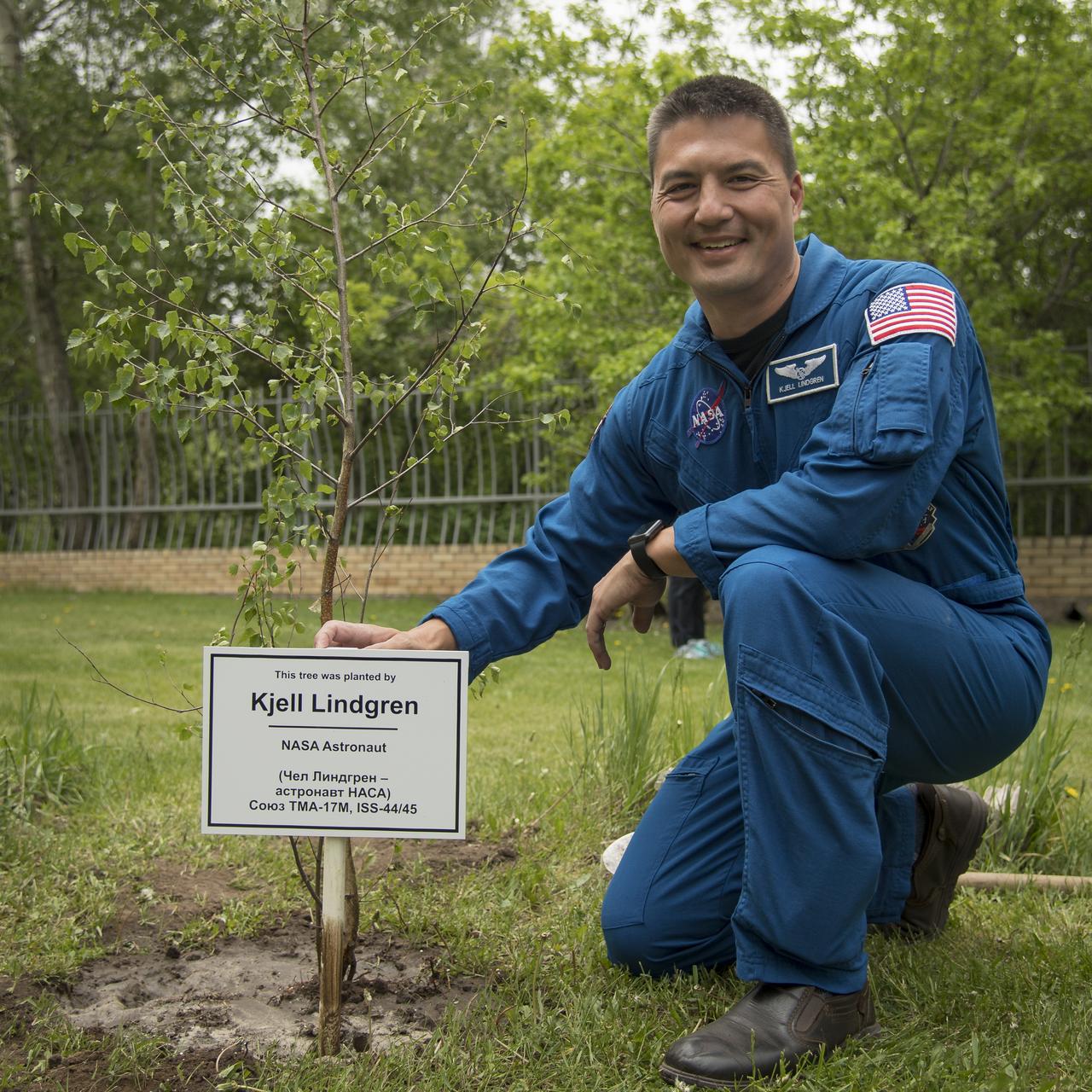 NASA astronaut and Astronaut Office Representative Kjell Lindgren is seen during a traditional tree planting ceremony at the Cosmonaut Hotel, Saturday, June 2, 2018 in Karaganda, Kazakhstan. Lindgren was in Karaganda to help support the Expedition 55 crew Soyuz landing from the International Space Station. Photo Credit: (NASA/Bill Ingalls)
