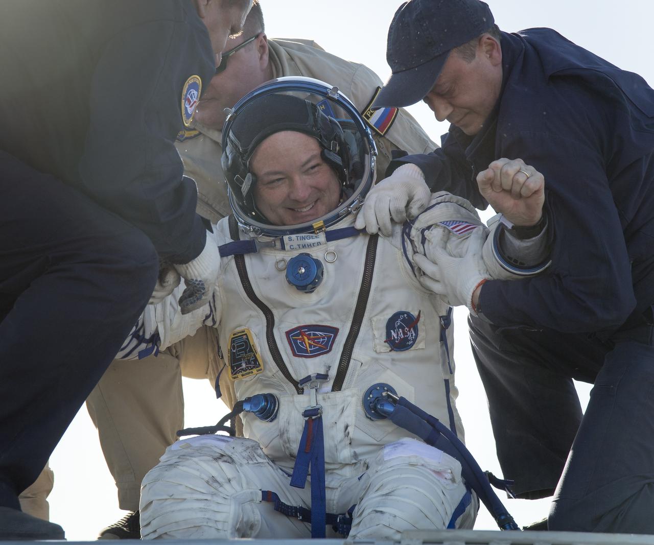 NASA astronaut Scott Tingle is helped out of the Soyuz MS-07 spacecraft just minutes after he, Japan Aerospace Exploration Agency (JAXA) astronaut Norishige Kanai, and Roscosmos cosmonaut Anton Shkaplerov landed in a remote area near the town of Zhezkazgan, Kazakhstan on Sunday, June 3, 2018. Shkaplerov, Tingle, and Kanai are returning after 168 days in space where they served as members of the Expedition 54 and 55 crews onboard the International Space Station. Photo Credit: (NASA/Bill Ingalls)
