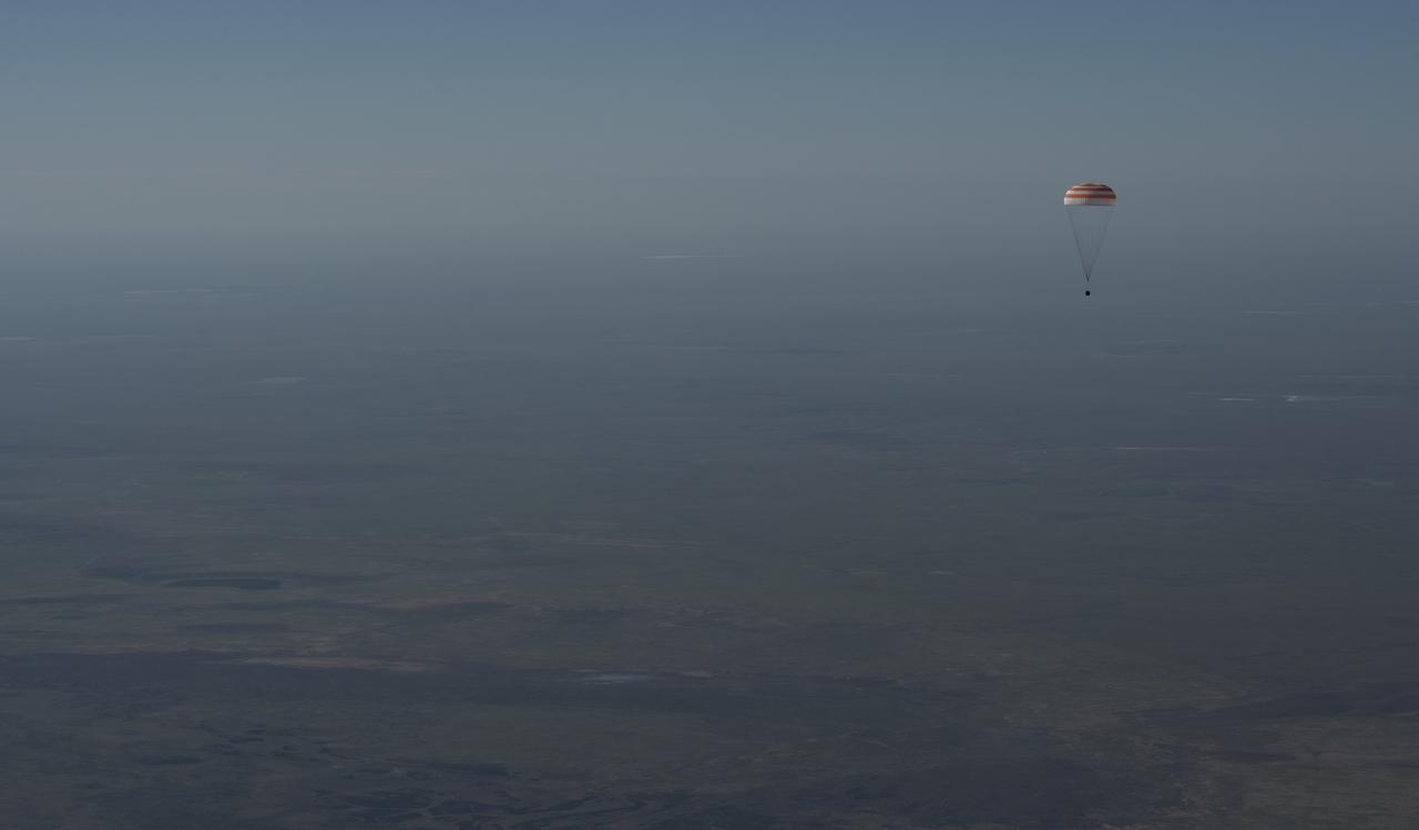 The Soyuz MS-07 spacecraft is seen as it lands with Expedition 55 crew members Anton Shkaplerov of Roscosmos, Scott Tingle of NASA, and Norishige Kanai of the Japan Aerospace Exploration Agency (JAXA) near the town of Zhezkazgan, Kazakhstan on Sunday, June 3, 2018. Shkaplerov, Tingle, and Kanai are returning after 168 days in space where they served as members of the Expedition 54 and 55 crews onboard the International Space Station. Photo Credit: (NASA/Bill Ingalls)