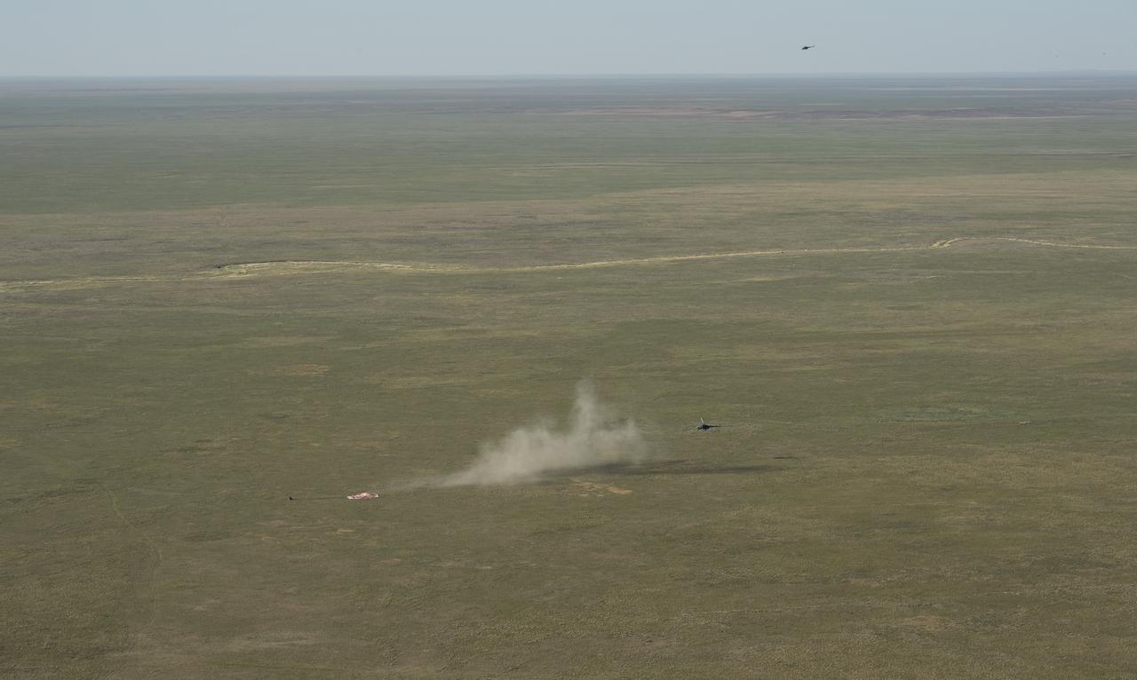 The Soyuz MS-07 spacecraft is seen as it lands with Expedition 55 crew members Anton Shkaplerov of Roscosmos, Scott Tingle of NASA, and Norishige Kanai of the Japan Aerospace Exploration Agency (JAXA) near the town of Zhezkazgan, Kazakhstan on Sunday, June 3, 2018. Shkaplerov, Tingle, and Kanai are returning after 168 days in space where they served as members of the Expedition 54 and 55 crews onboard the International Space Station. Photo Credit: (NASA/Bill Ingalls)