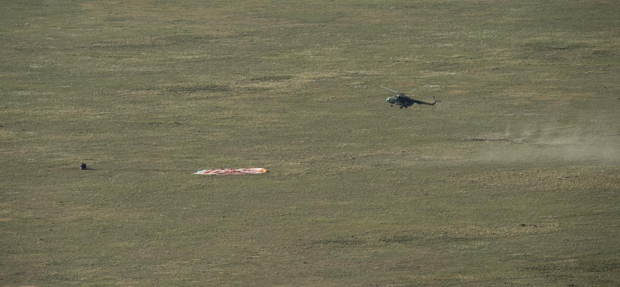The Soyuz MS-07 spacecraft is seen as it lands with Expedition 55 crew members Anton Shkaplerov of Roscosmos, Scott Tingle of NASA, and Norishige Kanai of the Japan Aerospace Exploration Agency (JAXA) near the town of Zhezkazgan, Kazakhstan on Sunday, June 3, 2018. Shkaplerov, Tingle, and Kanai are returning after 168 days in space where they served as members of the Expedition 54 and 55 crews onboard the International Space Station. Photo Credit: (NASA/Bill Ingalls)