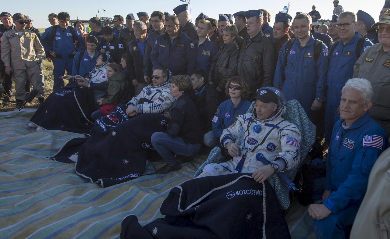 Japan Aerospace Exploration Agency (JAXA) astronaut Norishige Kanai, left, Roscosmos cosmonaut Anton Shkaplerov, center, and NASA astronaut Scott Tingle sit in chairs outside the Soyuz MS-07 spacecraft after they landed in a remote area near the town of Zhezkazgan, Kazakhstan on Sunday, June 3, 2018. Shkaplerov, Tingle, and Kanai are returning after 168 days in space where they served as members of the Expedition 54 and 55 crews onboard the International Space Station. Photo Credit: (NASA/Bill Ingalls)