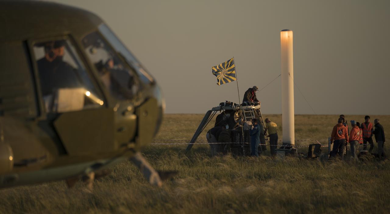 Russian support personnel work around the Soyuz MS-07 spacecraft shortly after it landed with Expedition 55 crew members Anton Shkaplerov of Roscosmos, Scott Tingle of NASA, and Norishige Kanai of the Japan Aerospace Exploration Agency (JAXA) near the town of Zhezkazgan, Kazakhstan on Sunday, June 3, 2018. Shkaplerov, Tingle, and Kanai are returning after 168 days in space where they served as members of the Expedition 54 and 55 crews onboard the International Space Station. Photo Credit: (NASA/Bill Ingalls)