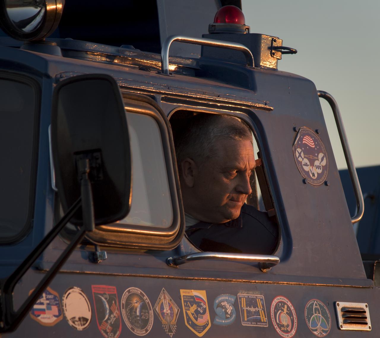 A driver of one of the Russian All-Terrain Vehicles  waits parked outside the medical tent after Expedition 55 crew members Anton Shkaplerov of Roscosmos, Scott Tingle of NASA, and Norishige Kanai of the Japan Aerospace Exploration Agency (JAXA) landed in their Soyuz MS-07 spacecraft near the town of Zhezkazgan, Kazakhstan on Sunday, June 3, 2018. Shkaplerov, Tingle, and Kanai are returning after 168 days in space where they served as members of the Expedition 54 and 55 crews onboard the International Space Station. Photo Credit: (NASA/Bill Ingalls)