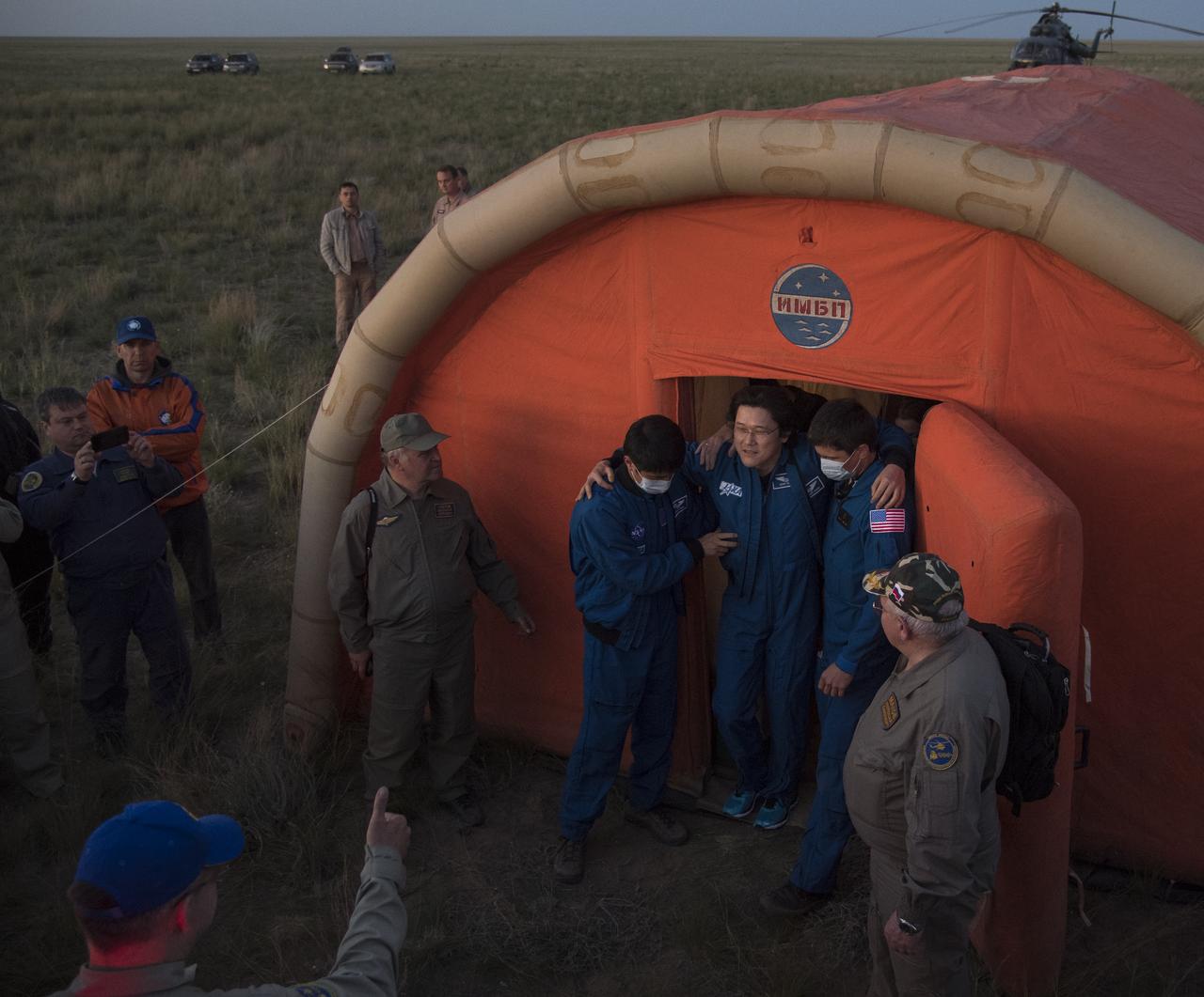 Japan Aerospace Exploration Agency (JAXA) astronaut Norishige Kanai departs the medical tent shortly after he and fellow Expedition 55 crew members, Roscosmos cosmonaut Anton Shkaplerov, and NASA astronaut Scott Tingle landed in their Soyuz MS-07 spacecraft near the town of Zhezkazgan, Kazakhstan on Sunday, June 3, 2018. Shkaplerov, Tingle, and Kanai are returning after 168 days in space where they served as members of the Expedition 54 and 55 crews onboard the International Space Station. Photo Credit: (NASA/Bill Ingalls)