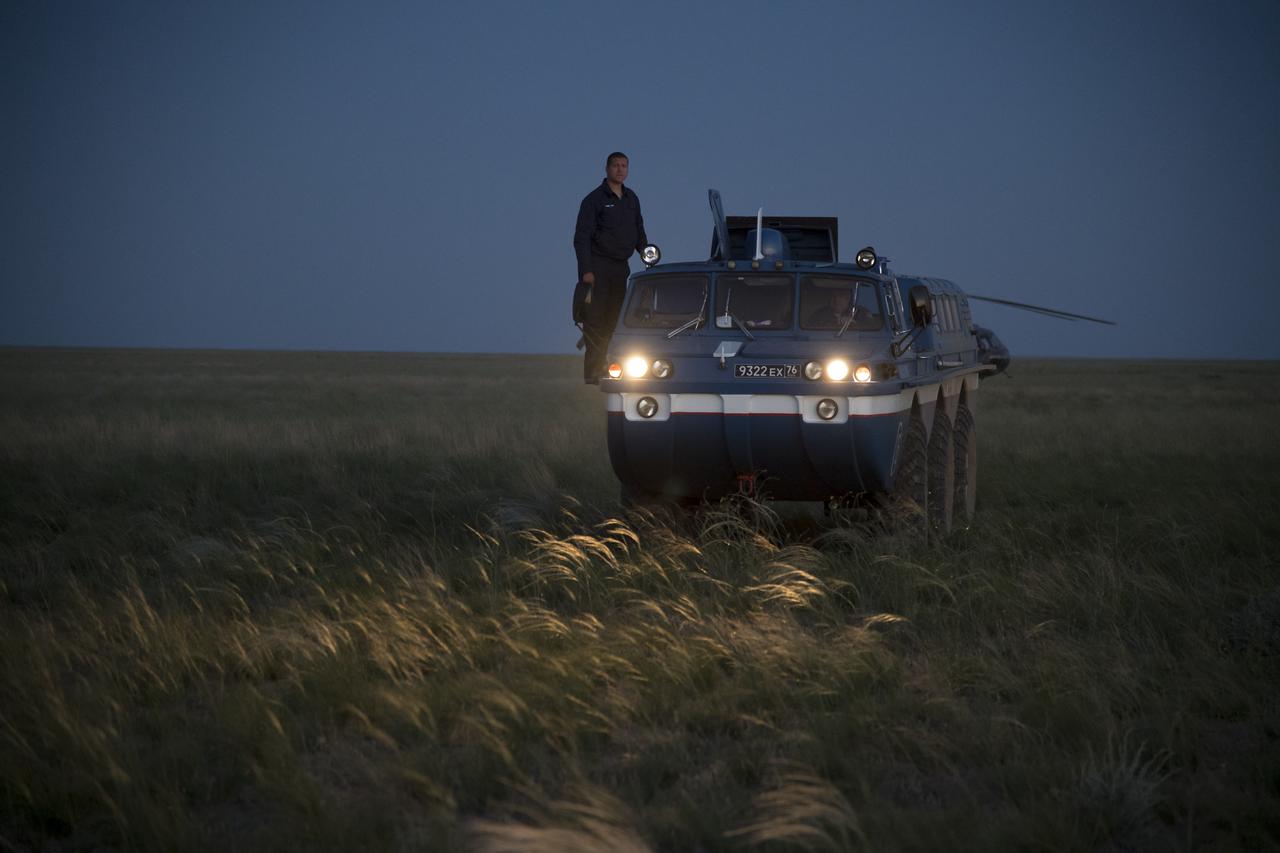 A Russian All-Terrain Vehicle (ATV) drives NASA astronaut Scott Tingle from the medical tent to an awaiting helicopter after he and fellow Expedition 55 crew members Anton Shkaplerov of Roscosmos, and Norishige Kanai of the Japan Aerospace Exploration Agency (JAXA) landed in their Soyuz MS-07 spacecraft near the town of Zhezkazgan, Kazakhstan on Sunday, June 3, 2018. Shkaplerov, Tingle, and Kanai are returning after 168 days in space where they served as members of the Expedition 54 and 55 crews onboard the International Space Station. Photo Credit: (NASA/Bill Ingalls)