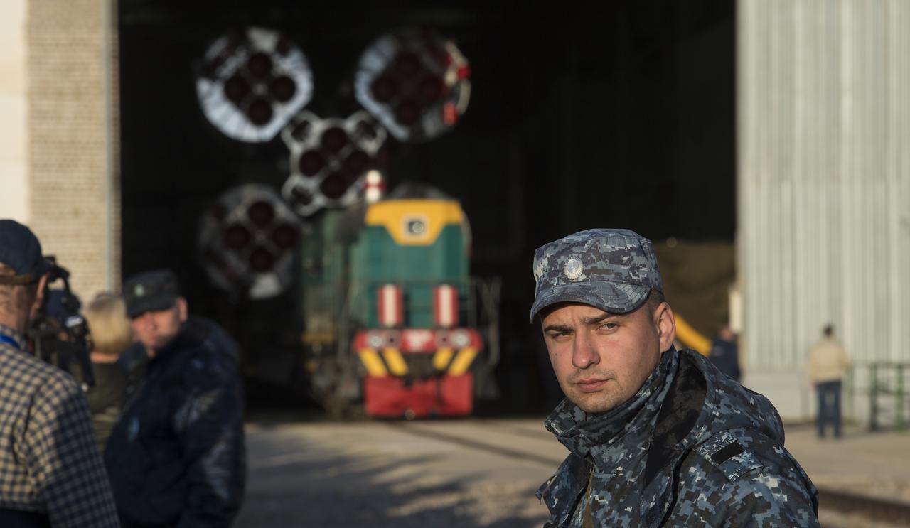 Security personnel are seen outside of Building 112 prior to the Soyuz rocket being rolled out by train to the launch pad, Monday, June 4, 2018 at the Baikonur Cosmodrome in Kazakhstan. Expedition 56 Soyuz Commander Sergey Prokopyev of Roscosmos, flight engineer Serena Auñón-Chancellor of NASA, and flight engineer Alexander Gerst of ESA (European Space Agency) are scheduled to launch aboard their Soyuz MS-09 spacecraft at 7:12 a.m. Eastern time (5:12 p.m. Baikonur time), on Wednesday, June 6. Photo Credit: (NASA/Joel Kowsky)