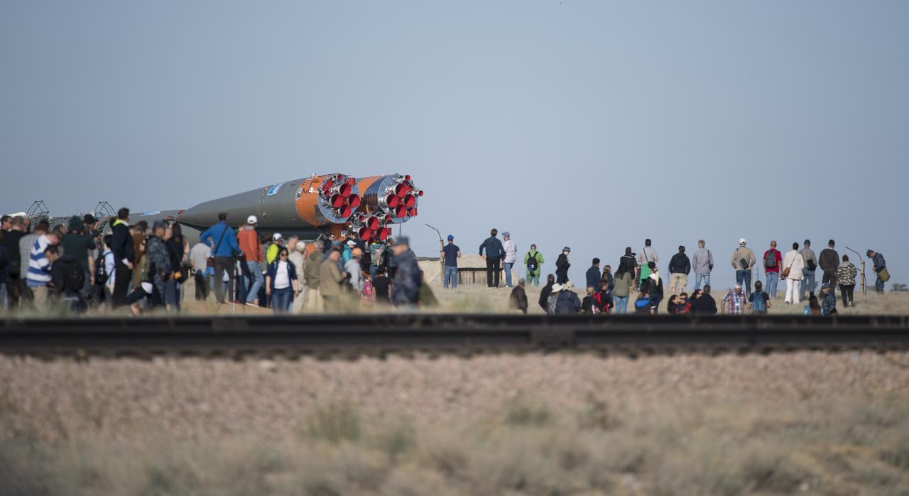 Launch guests and members of the media watch as the Soyuz rocket is rolled out by train to the launch pad, Monday, June 4, 2018 at the Baikonur Cosmodrome in Kazakhstan. Expedition 56 Soyuz Commander Sergey Prokopyev of Roscosmos, flight engineer Serena Auñón-Chancellor of NASA, and flight engineer Alexander Gerst of ESA (European Space Agency) are scheduled to launch aboard their Soyuz MS-09 spacecraft at 7:12 a.m. Eastern time (5:12 p.m. Baikonur time), on Wednesday, June 6. Photo Credit: (NASA/Joel Kowsky)